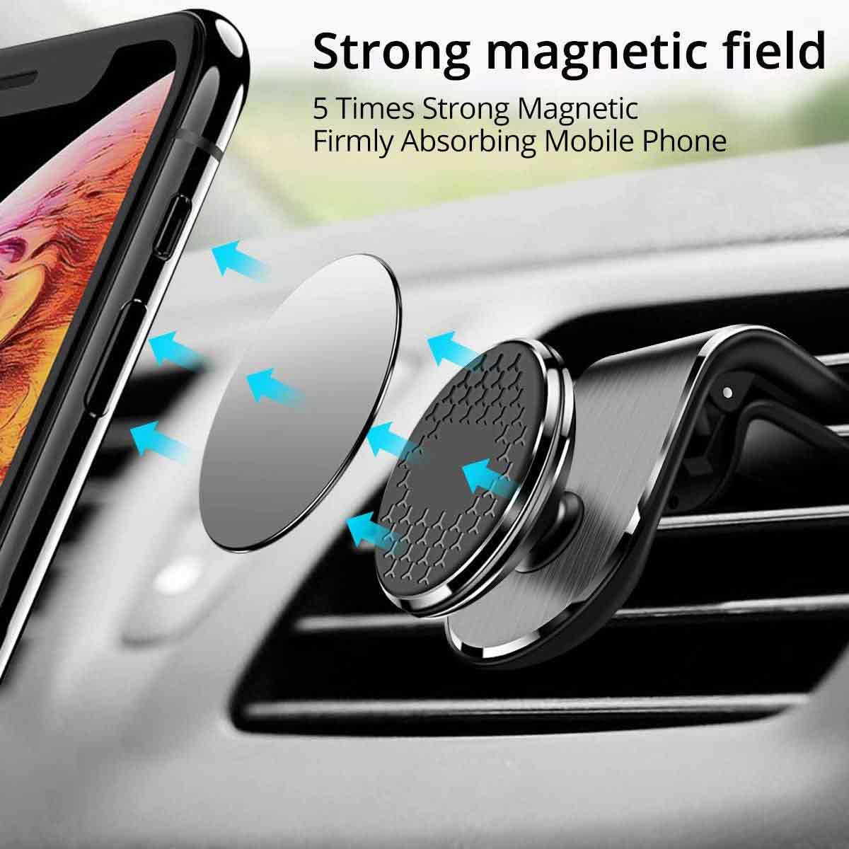 Silberner, kreisförmiger magnetischer Telefonhalter an der Auto-Lüftung. Telefon nicht sichtbar.