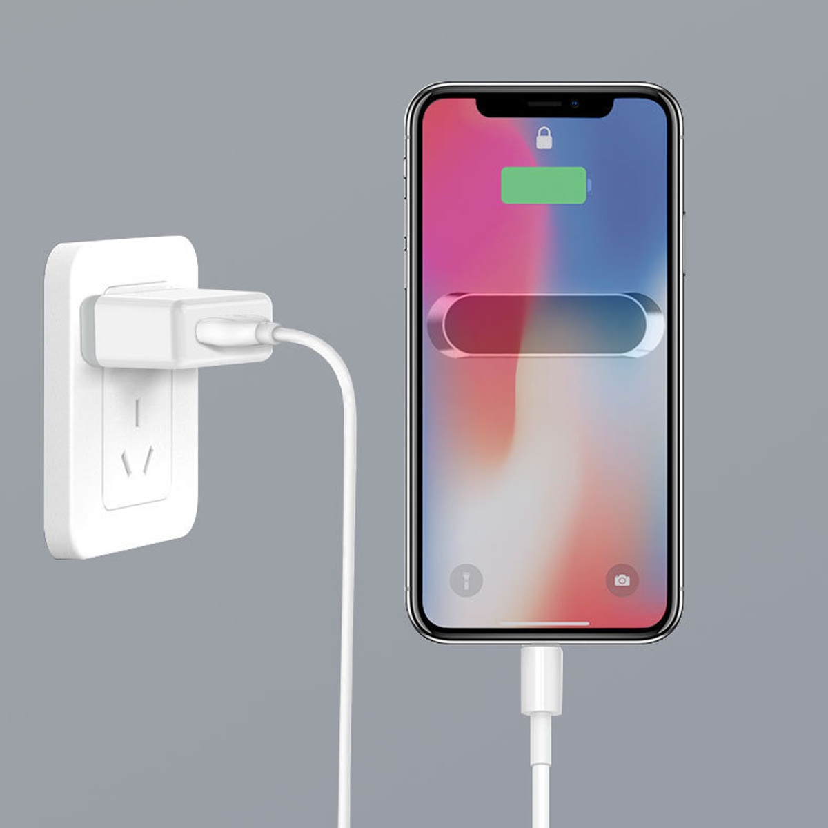 Ein Telefon, das mit einem weißen Ladegerät und einem weißen Kabel geladen wird. Eine grüne Batterieanzeige.