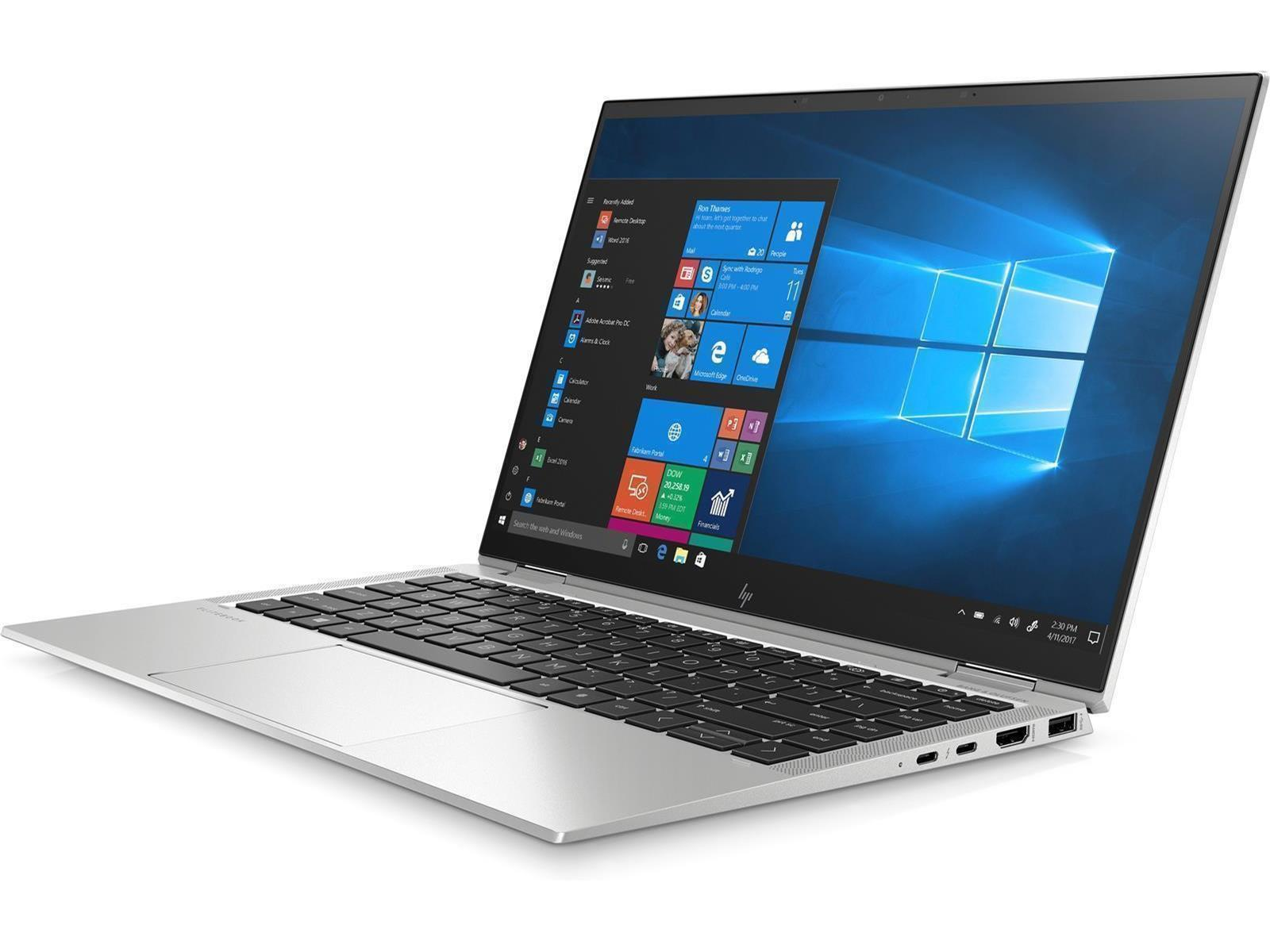 Ein silberner Laptop, der geöffnet ist und Windows zeigt. Der Bildschirm zeigt ein blaues Fensterdesign.