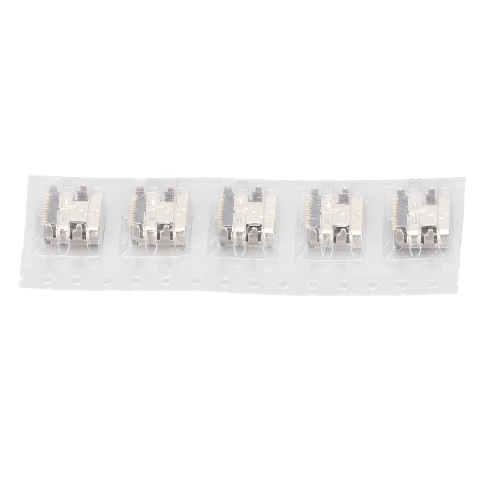 Fünf silberfarbene Stecker in einem transparenten Kunststoffstreifen, für elektronische Geräteanschlüsse.