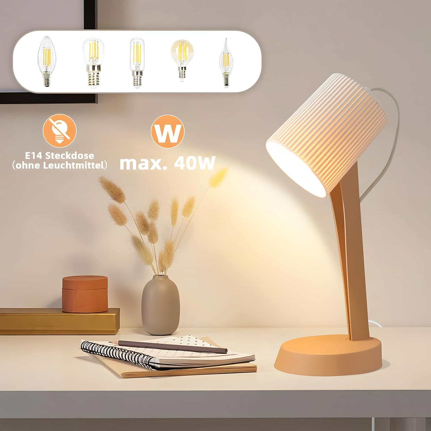 Lampa biurkowa z białym abażurem i różową podstawą. W tle różne żarówki.