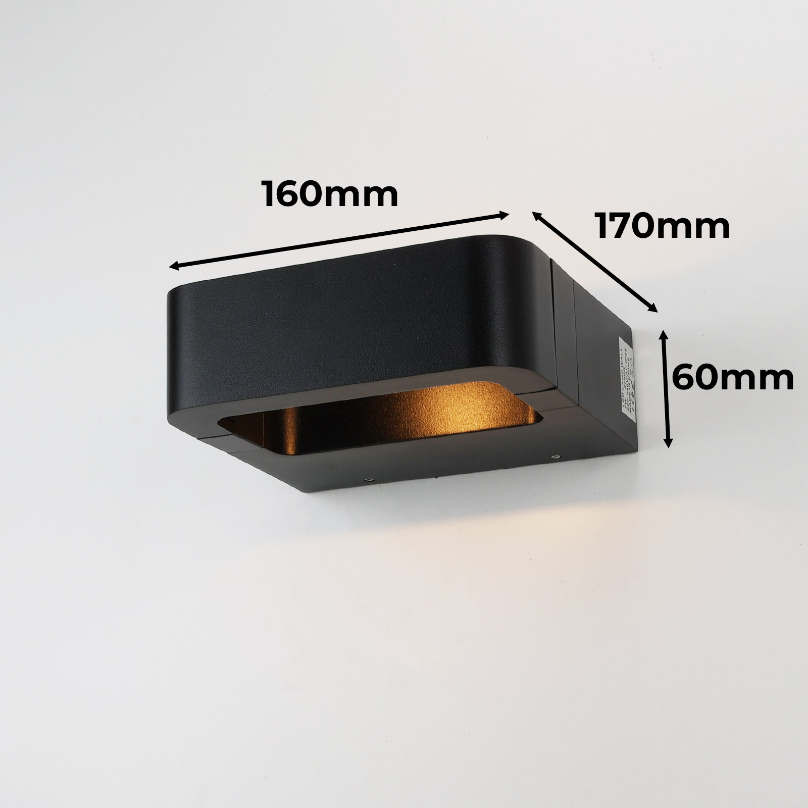 Una lámpara de pared negra y rectangular con dimensiones mostradas. Las dimensiones son 160mm x 170mm x 60mm.