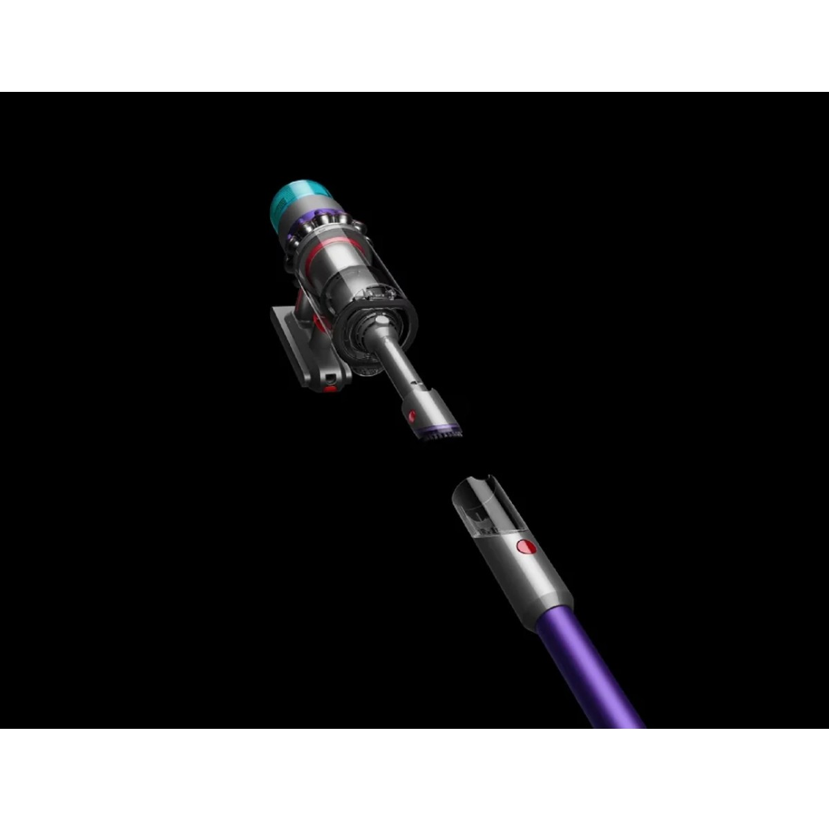 Fioletowy i srebrny odkurzacz z odłączonym przedłużeniem, na czarnym tle.