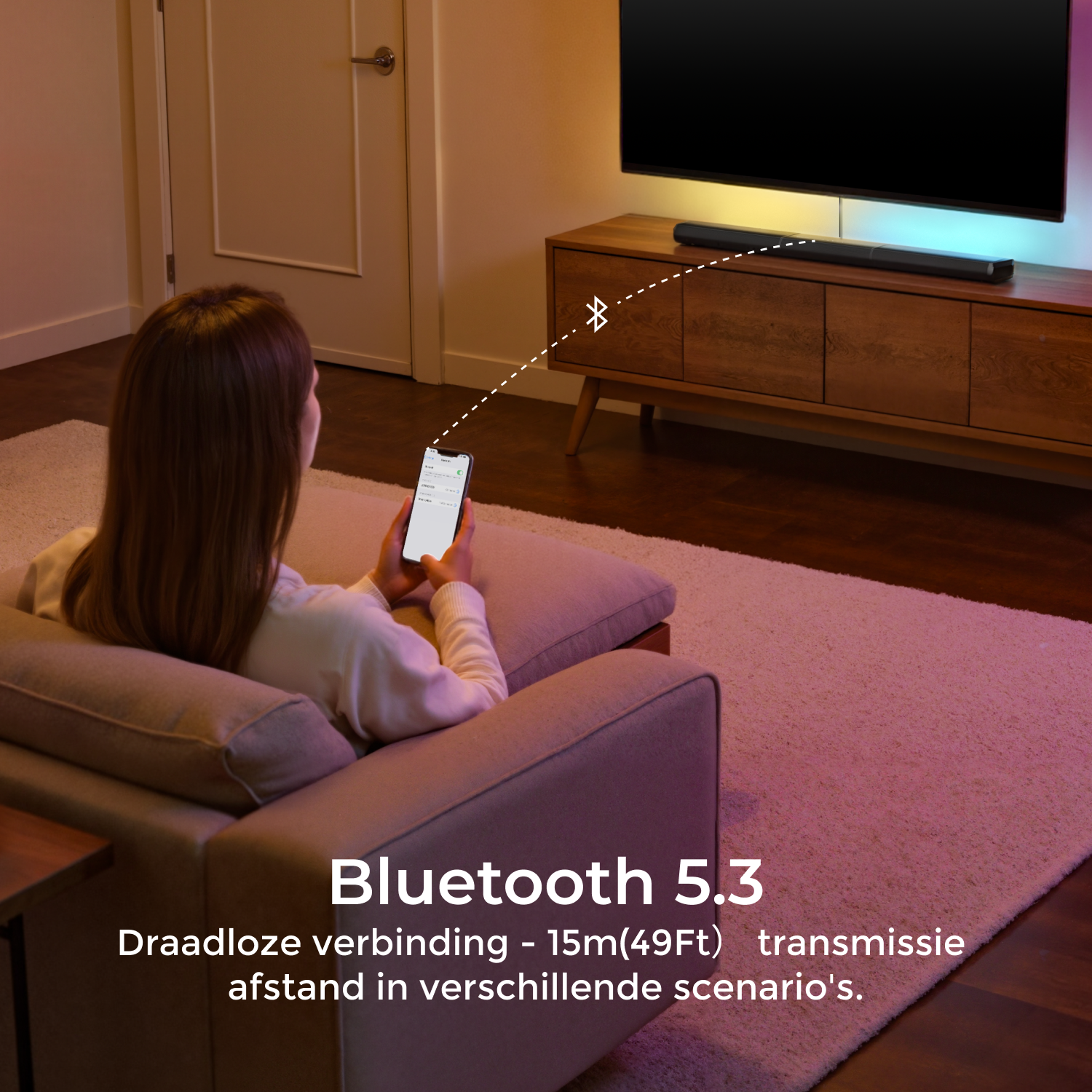 Woman using smartphone connected to a soundbar on a TV stand.