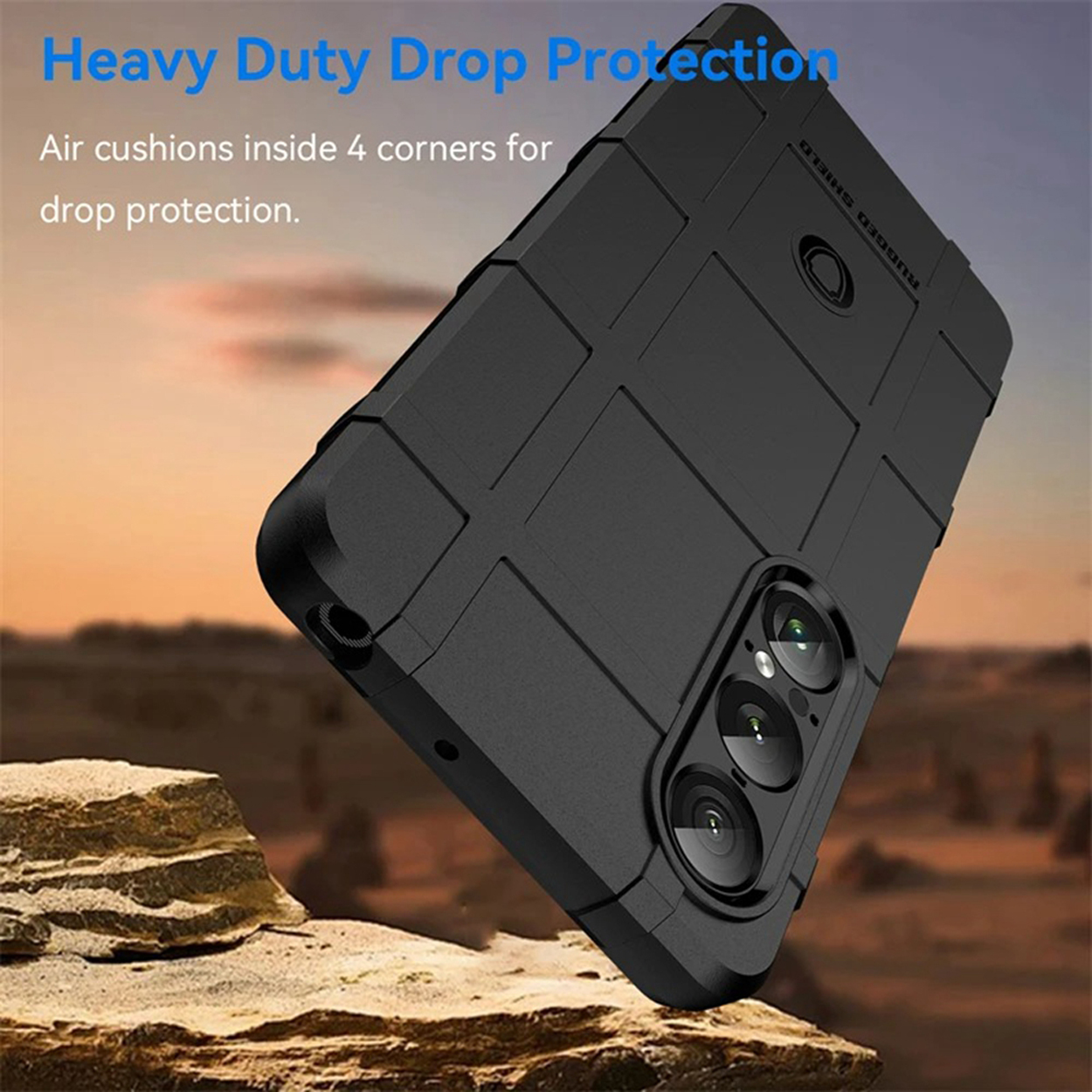 Zwarte telefoonhoes in een hoek. De tekst luidt 'Heavy Duty Drop Protection'. De hoes heeft een getextureerd rasterpatroon.