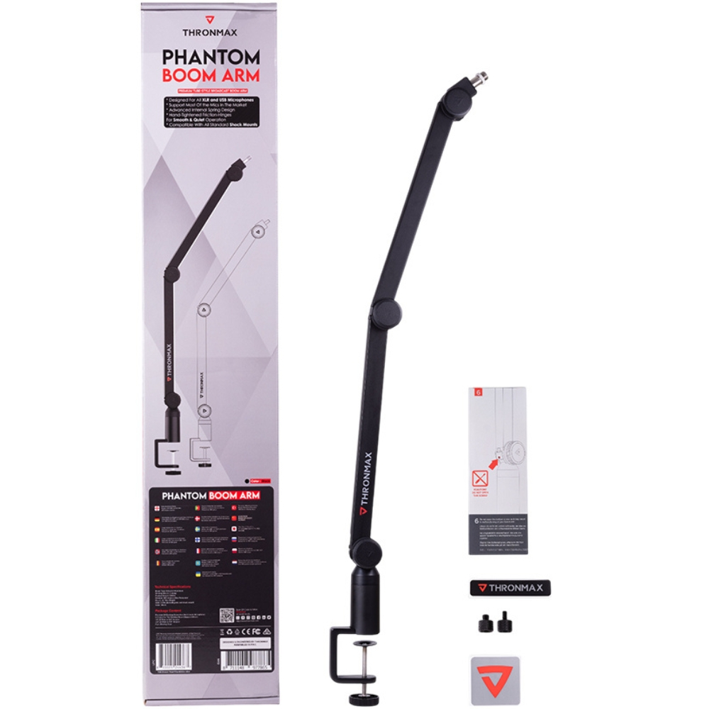 Una scatola del braccio Thronmax Phantom con istruzioni e accessori aggiuntivi accanto.