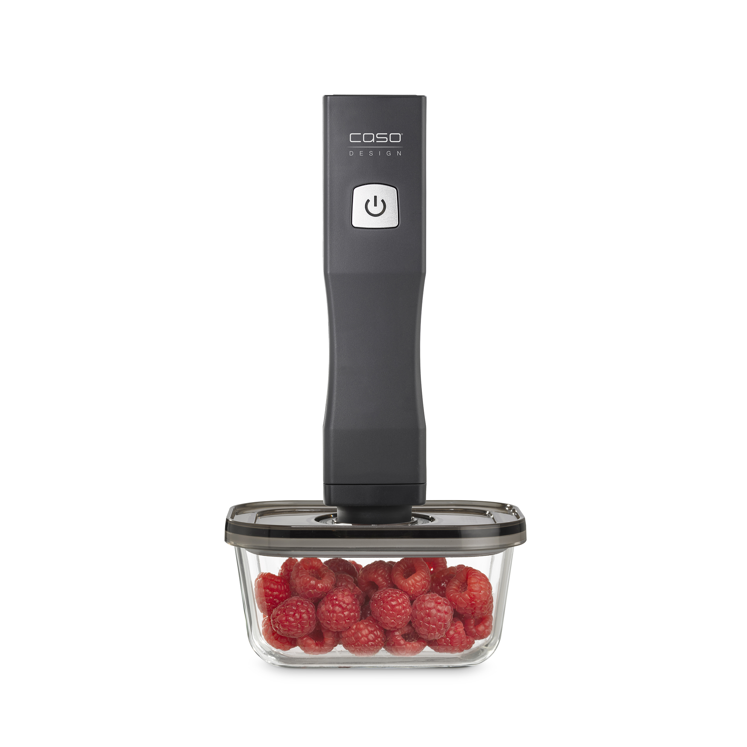 Vakuumiergerät mit einem Behälter mit Himbeeren. Die Himbeeren sind in einem durchsichtigen Behälter.