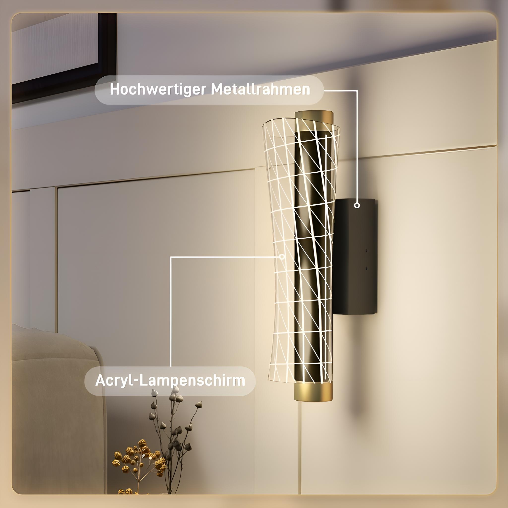Eine Wandlampe mit Metallrahmen und weißem Gitter über einem schwarzen Zylinder. Die Basis ist schwarz.