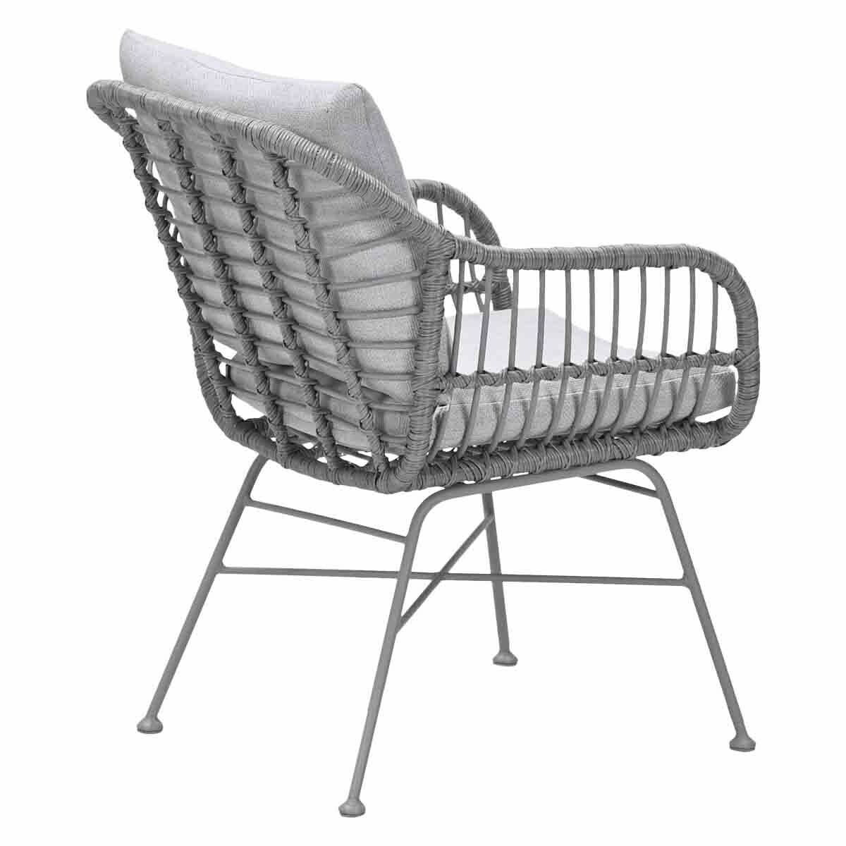 Gray woven chair with cushion. It has metal legs and is on a white background.