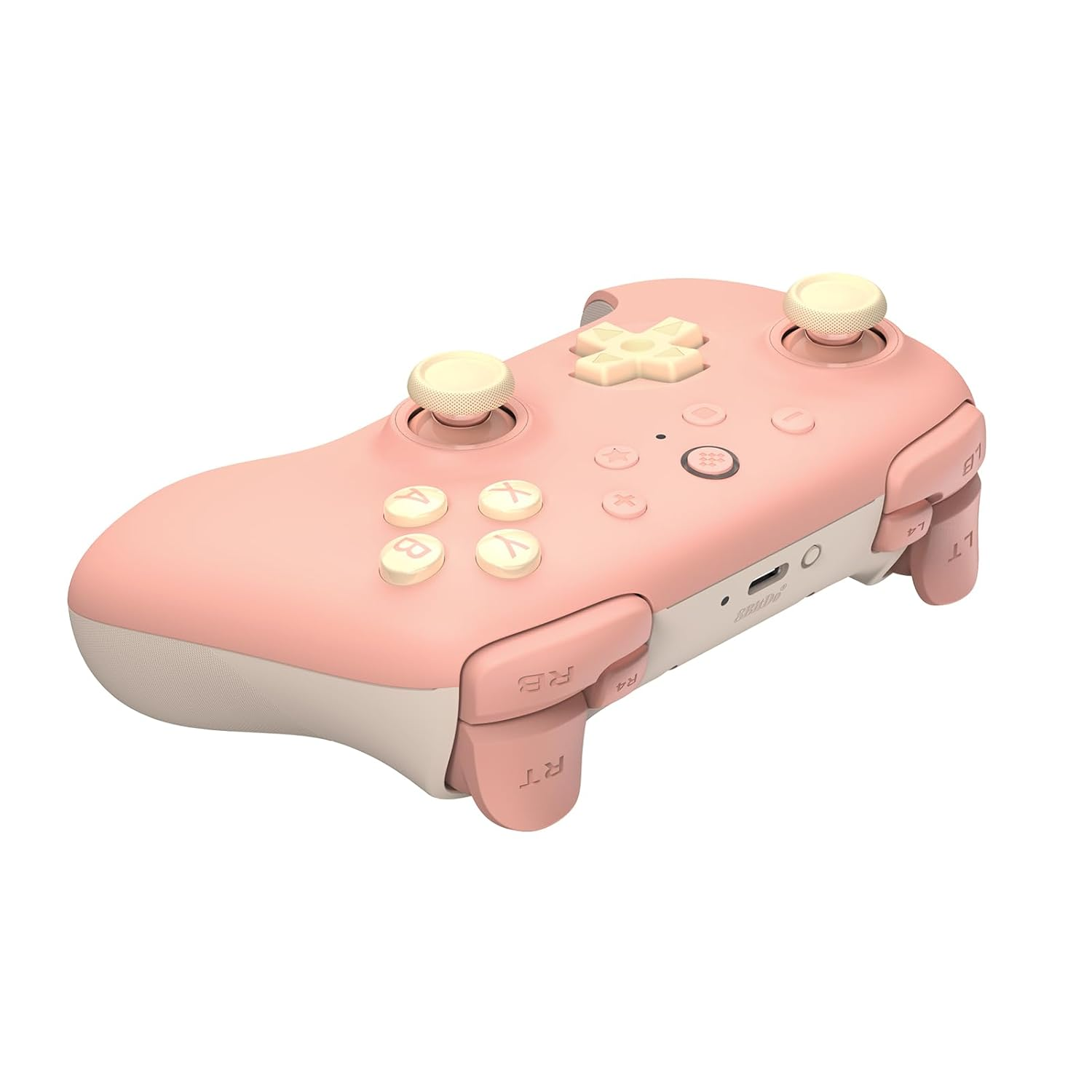 Mando de juego rosa y blanco con botones, joysticks y botones de hombro.