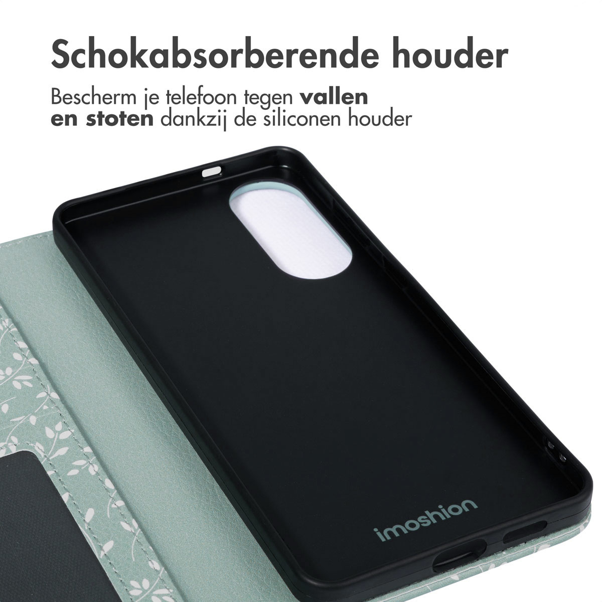 Gros plan sur l'intérieur d'un étui de téléphone avec un motif de feuilles vert menthe, étui de téléphone noir. Marque : imoshion.
