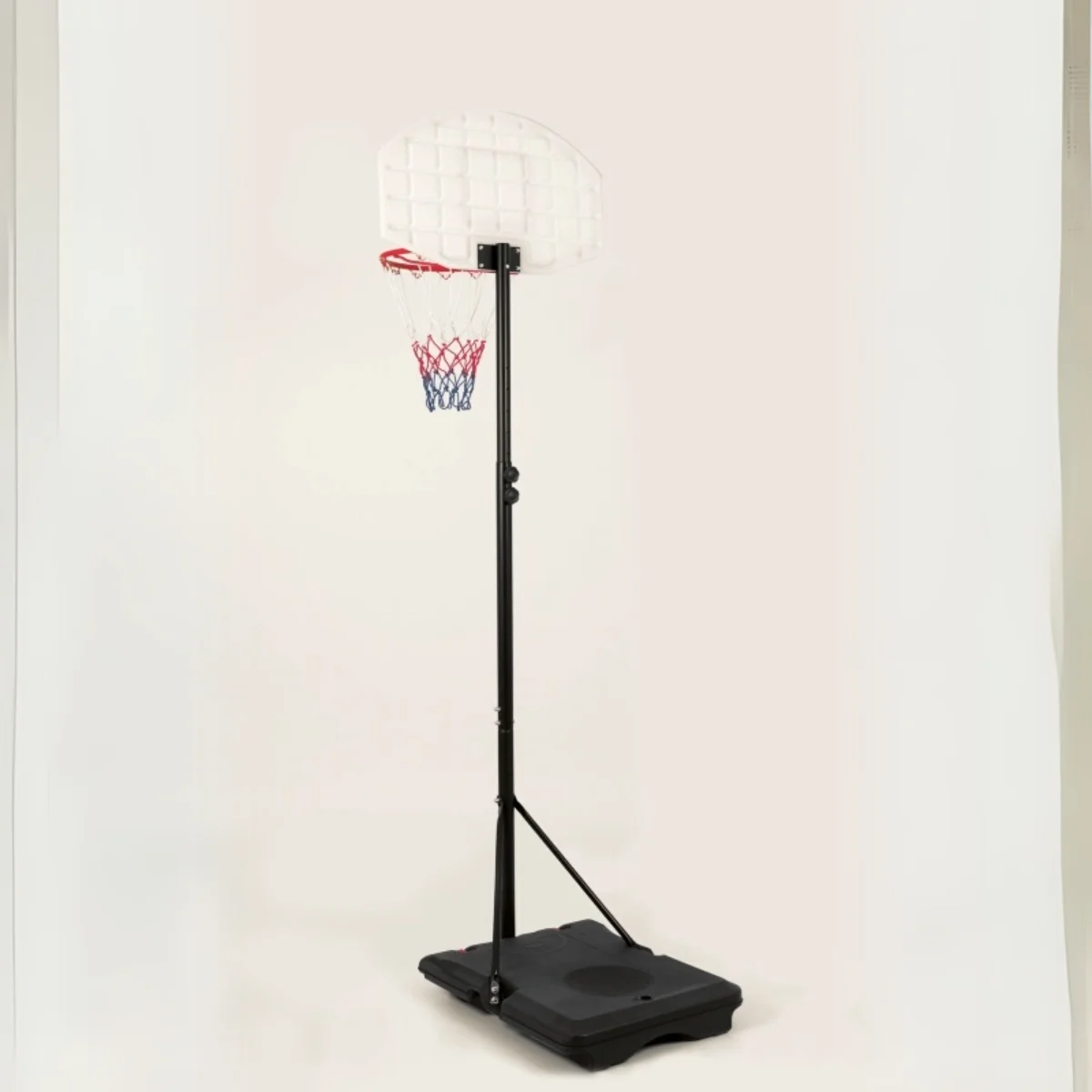 A basketball hoop with a white backboard on a black stand. The net is red and blue.