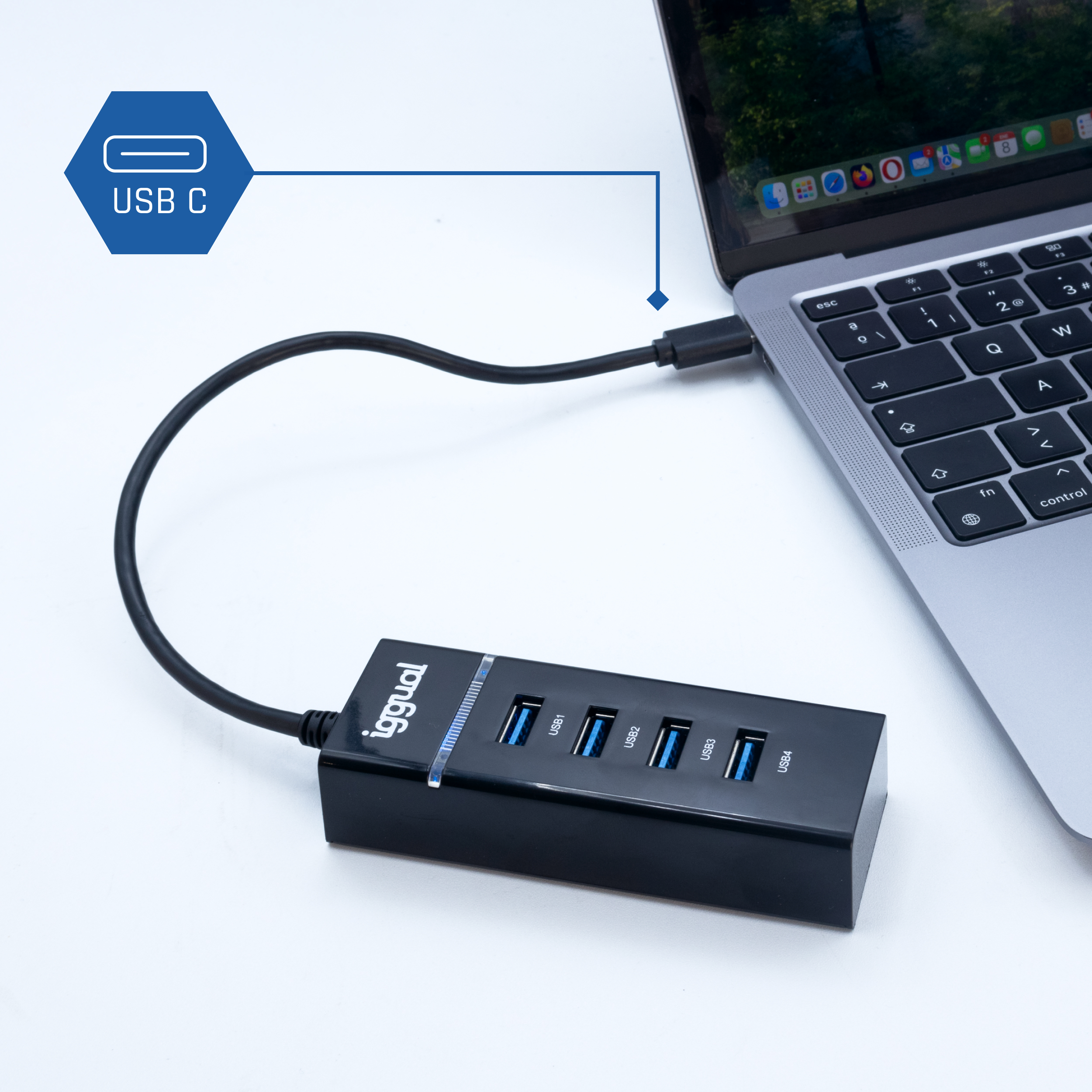 Concentrador USB conectado a una laptop con un cable USB-C, con texto que indica USB-C.