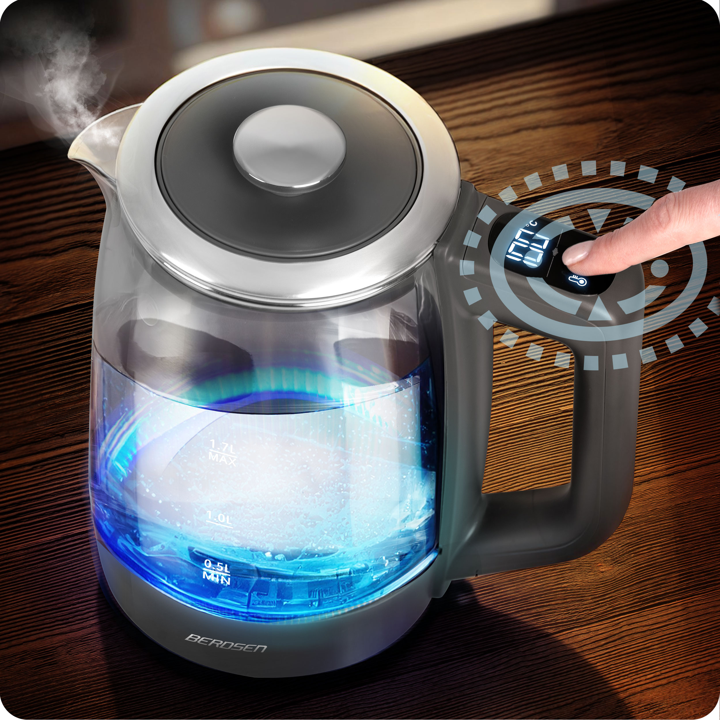 Palec osoby naciska przycisk na czajniku BERDSEN.