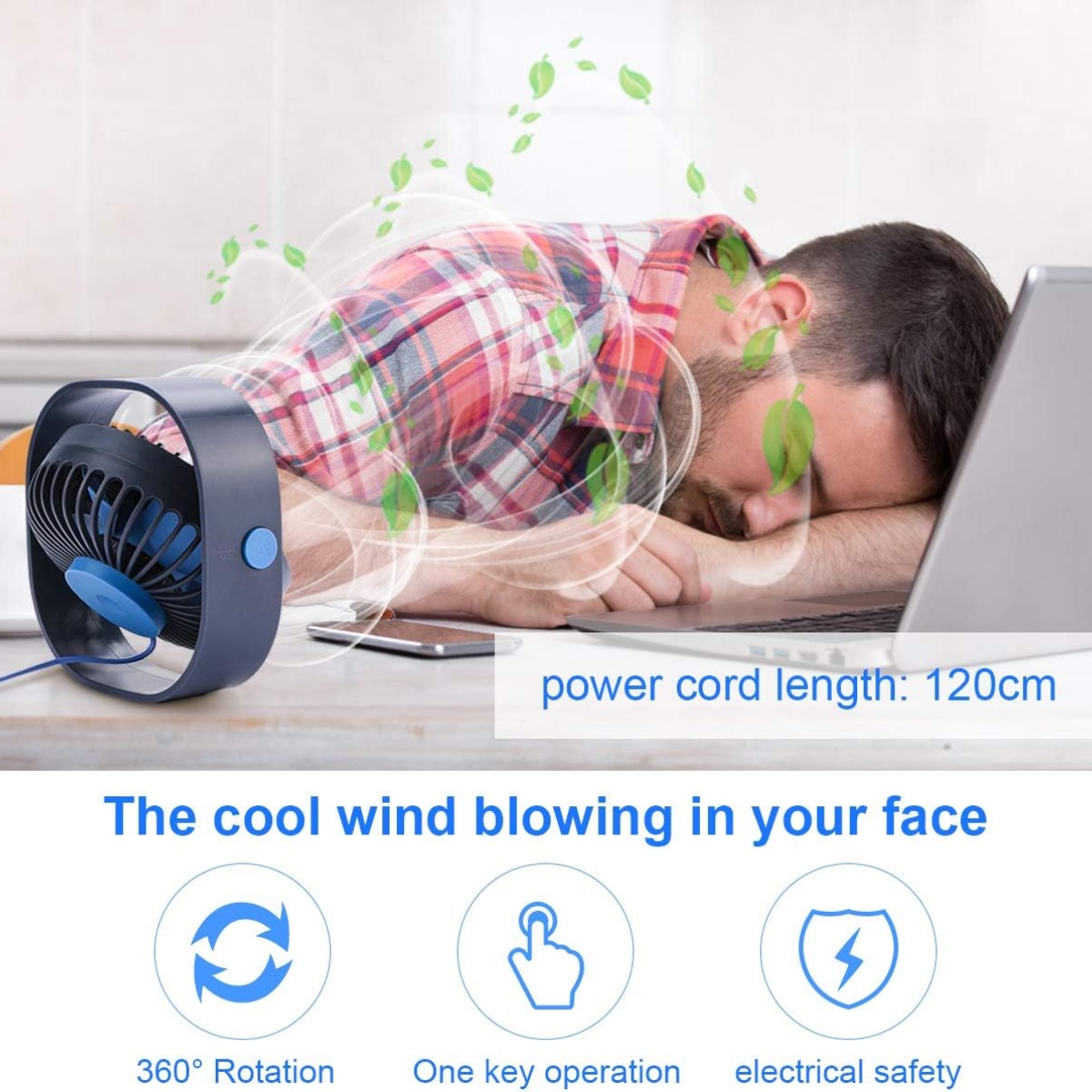 Eine Person schläft, ein Ventilator bläst auf sie. Es gibt Blätter und einen Laptop.