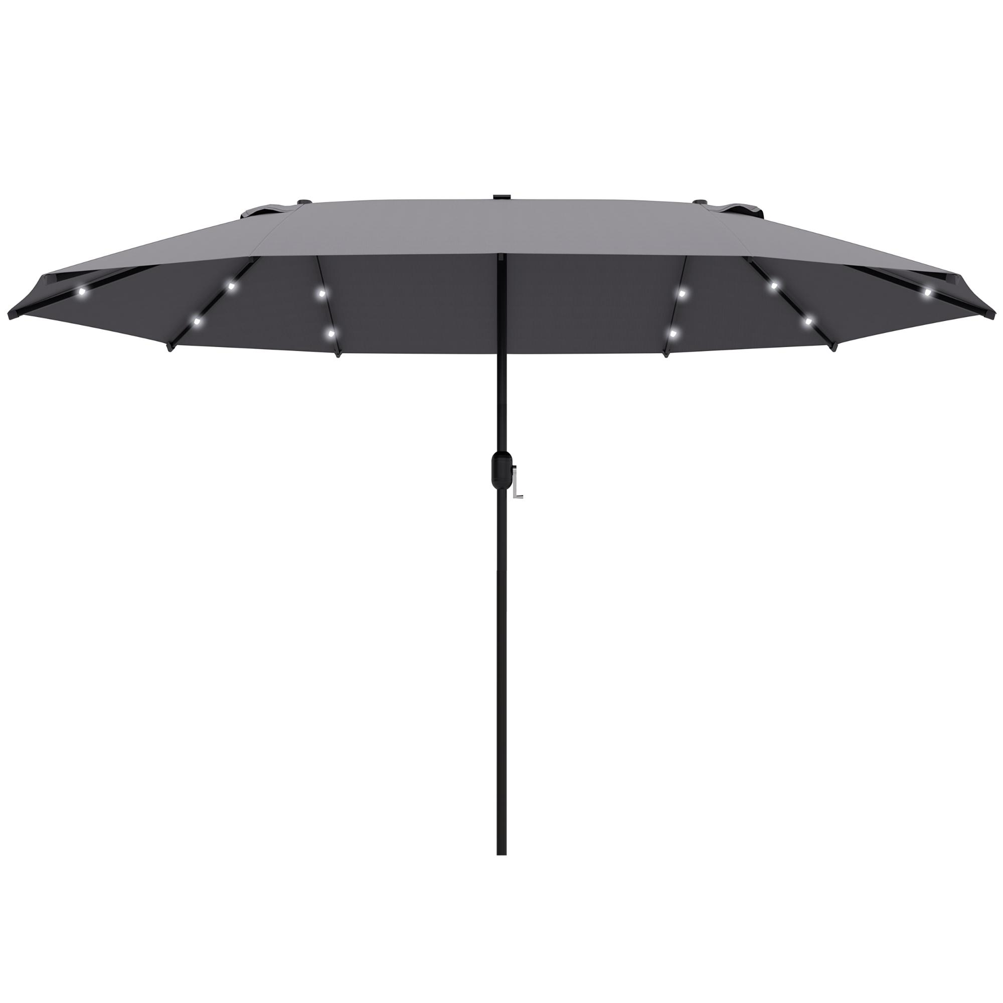 Grauer Regenschirm mit Lichtern auf der Innenseite. Er ist geöffnet und hat eine schwarze Stange. Der Hintergrund ist blauer Himmel.