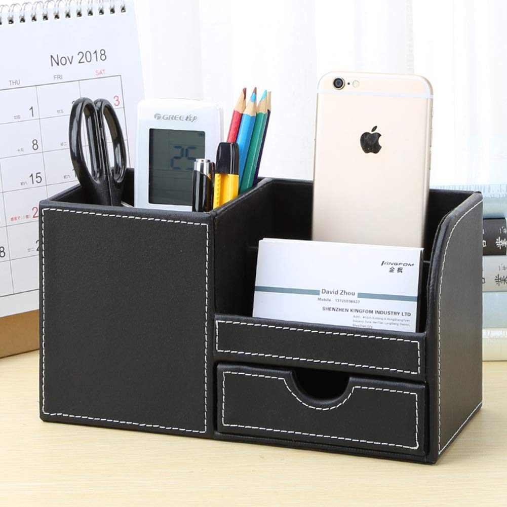 Ein schwarzer Schreibtisch-Organizer mit Schublade, der Stifte, ein Telefon, eine Schere und ein kleines Digitaldisplay hält.