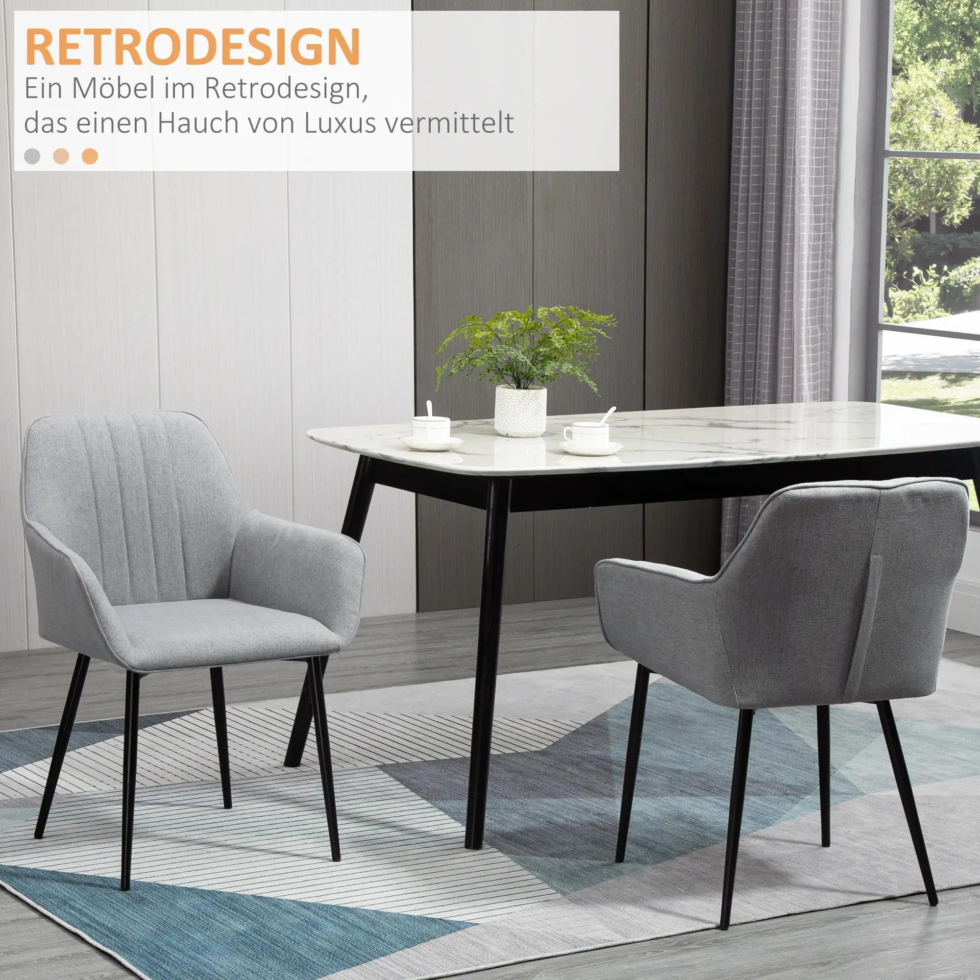 Zwei graue Stühle neben einem Tisch. Text: RETRODESIGN. Die Szene hat einen luxuriösen Touch.