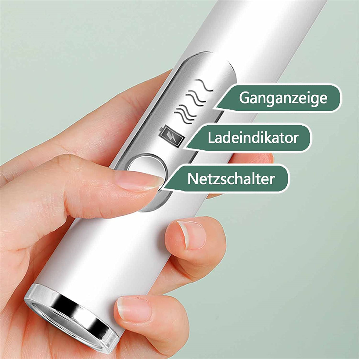 Eine Hand hält ein weißes Gerät mit Tasten für Batterie, Wärme und Strom.