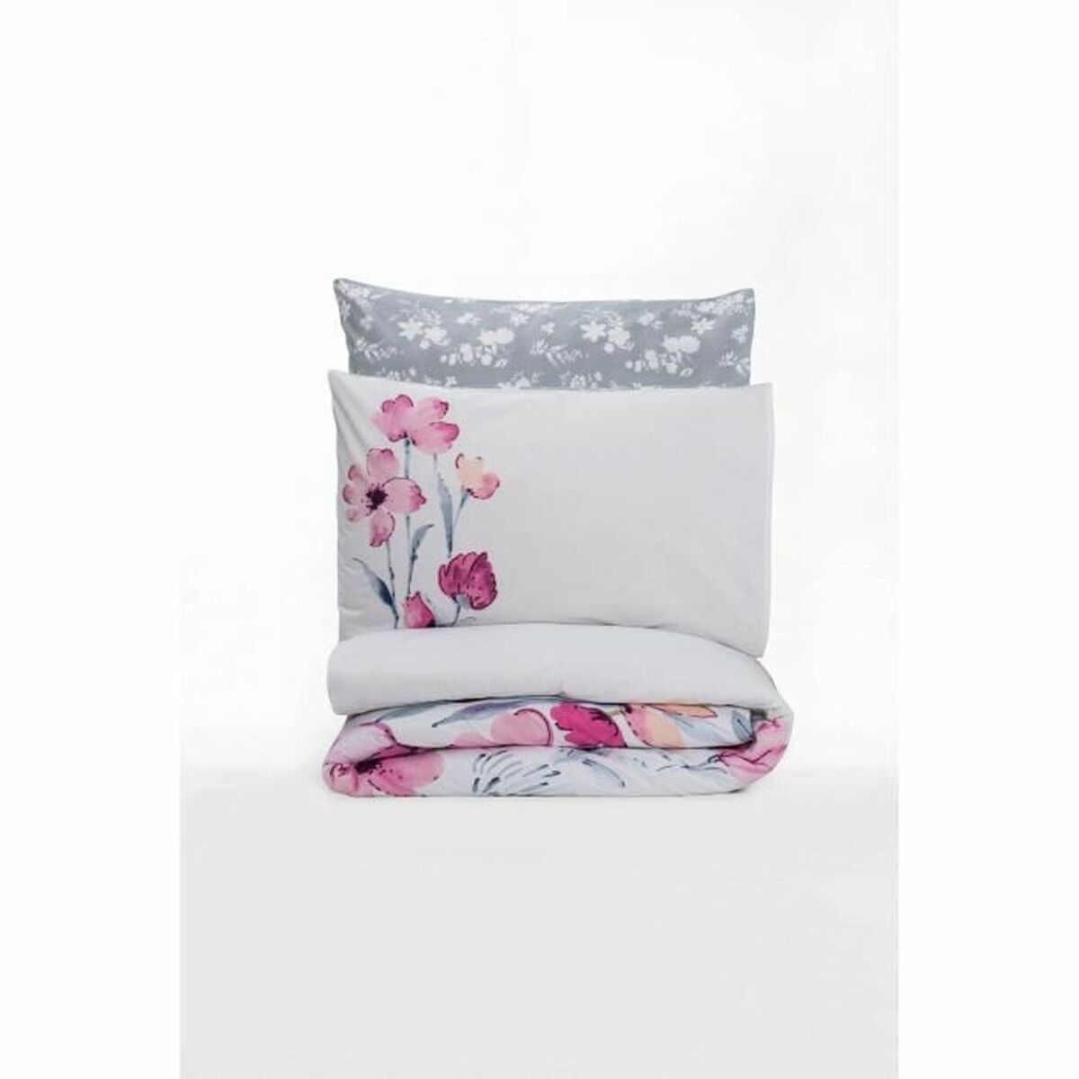 Gefaltete weiße Bettwäsche mit rosa Blumenmuster. Ein Kissen mit grauem Muster.