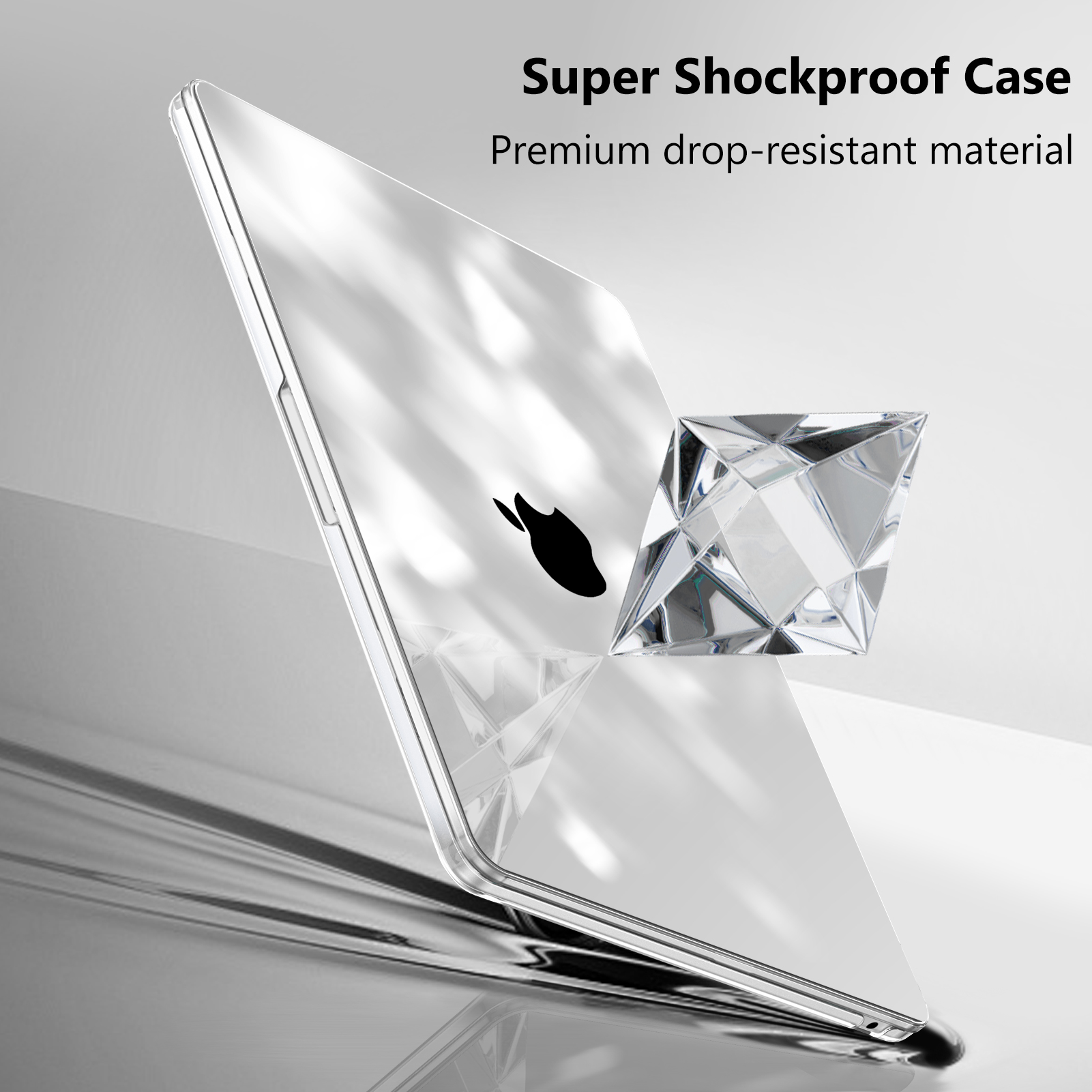 Transparente Laptop-Hülle. Apple-Logo sichtbar. Diamantförmiges Objekt. Text: Super stoßfeste Hülle.