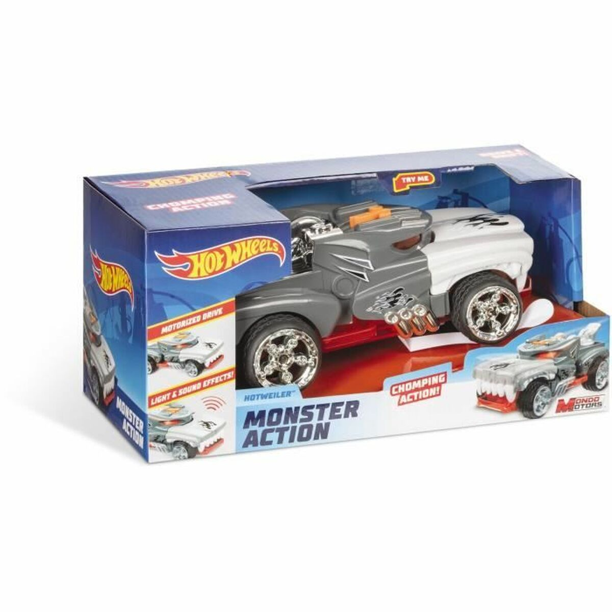 Un camión de juguete Hot Wheels Monster Action se muestra en su embalaje. El camión es gris con mandíbulas rojas.