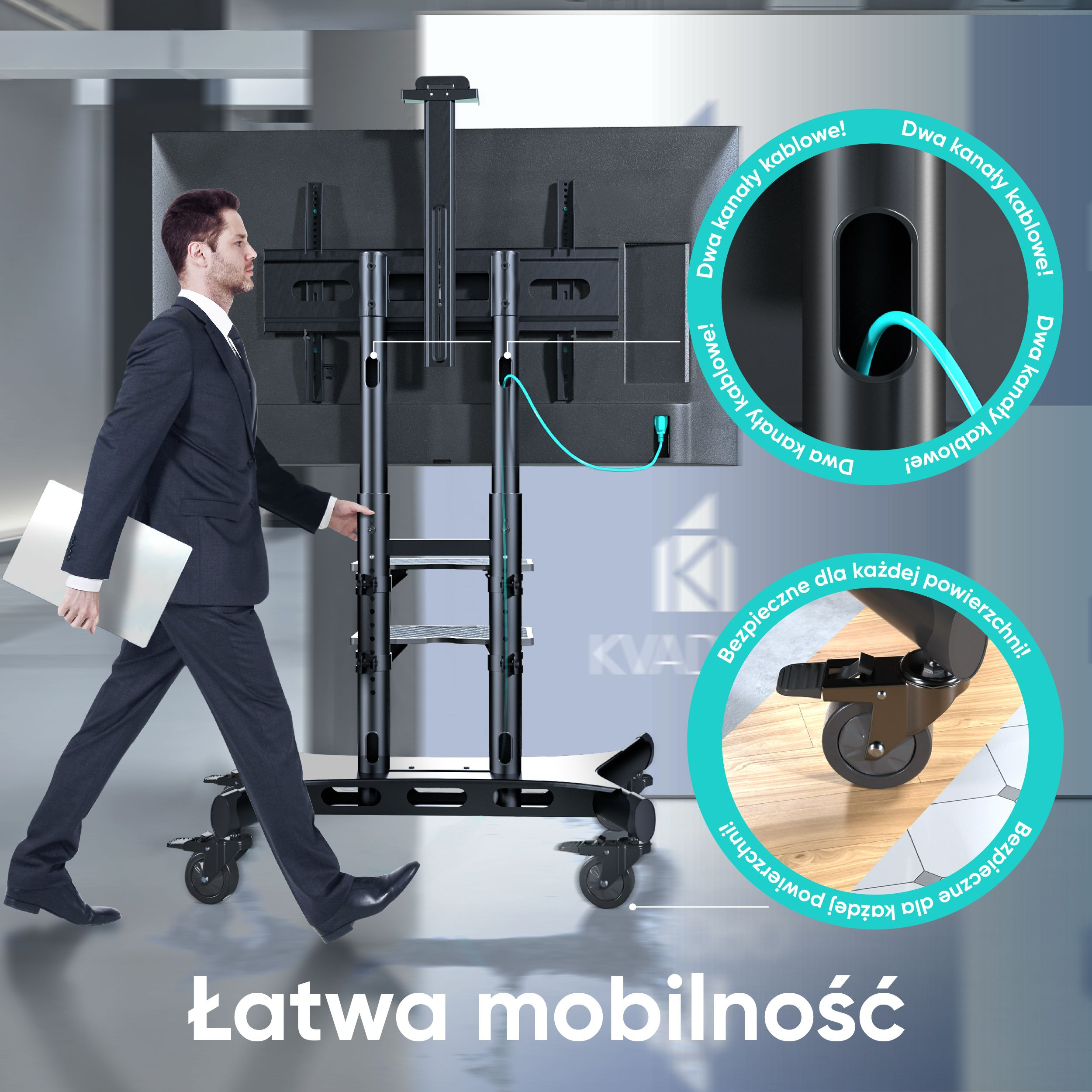 Mężczyzna w garniturze przechodzi obok czarnego stojaka pod telewizor z dużym ekranem TV, widoczne kable. Tekst: 'Łatwa mobilność'.