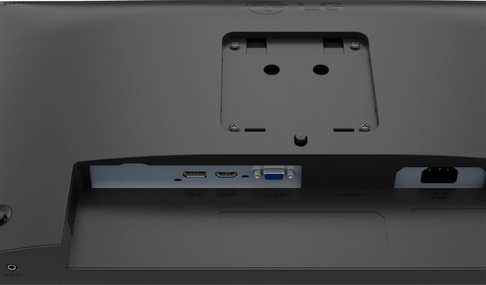 Close-up of the back of a black computer monitor with ports and screws visible.