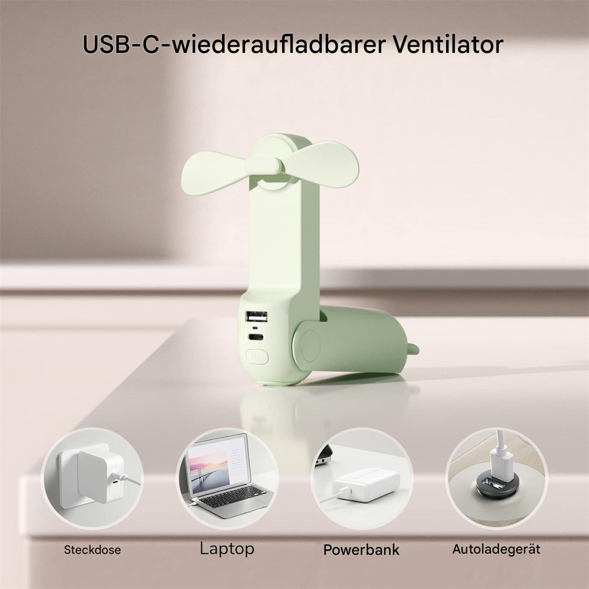 Ein mintgrüner tragbarer Ventilator mit Ladegerät und USB-Anschlüssen, auf einer weißen Oberfläche.