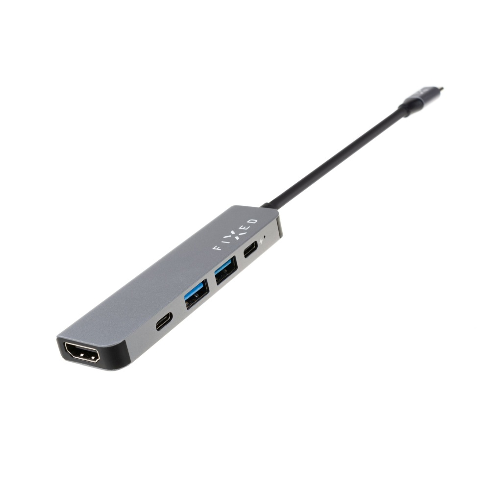 Ein grauer FIXED-Hub mit schwarzem Kabel und USB-C-Anschluss. Der Hub ist zur Kamera geneigt.