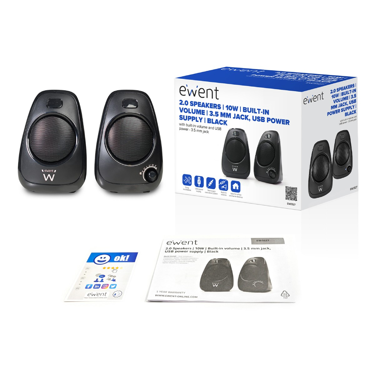 Dwa czarne głośniki i pudełko z ich zdjęciem. Na pudełku znajduje się tekst.