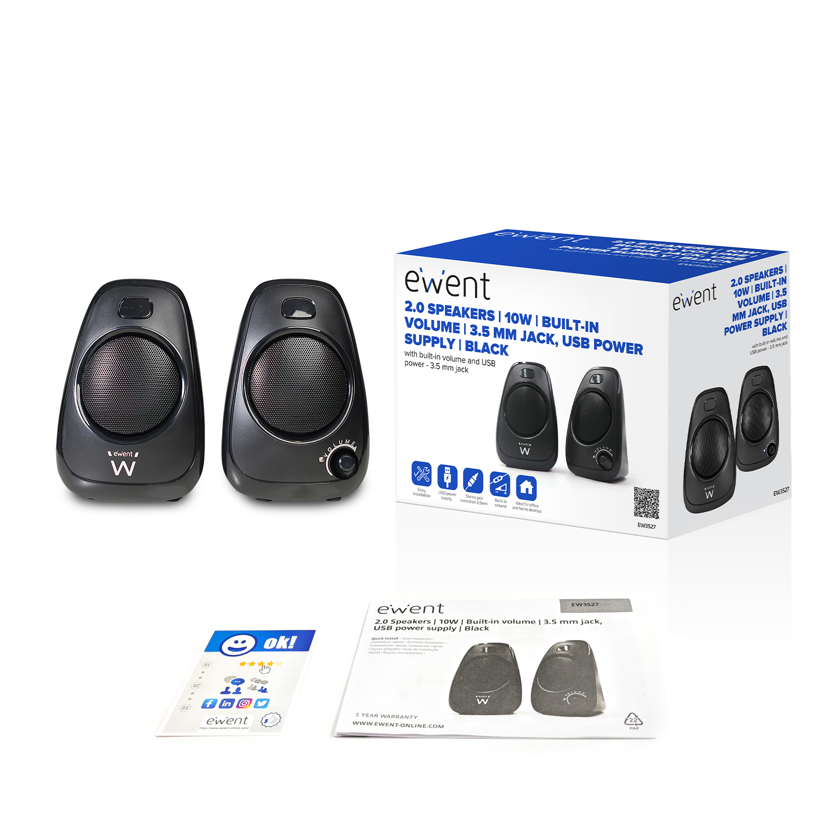 Dwa czarne głośniki i pudełko z ich zdjęciem. Na pudełku znajduje się tekst.