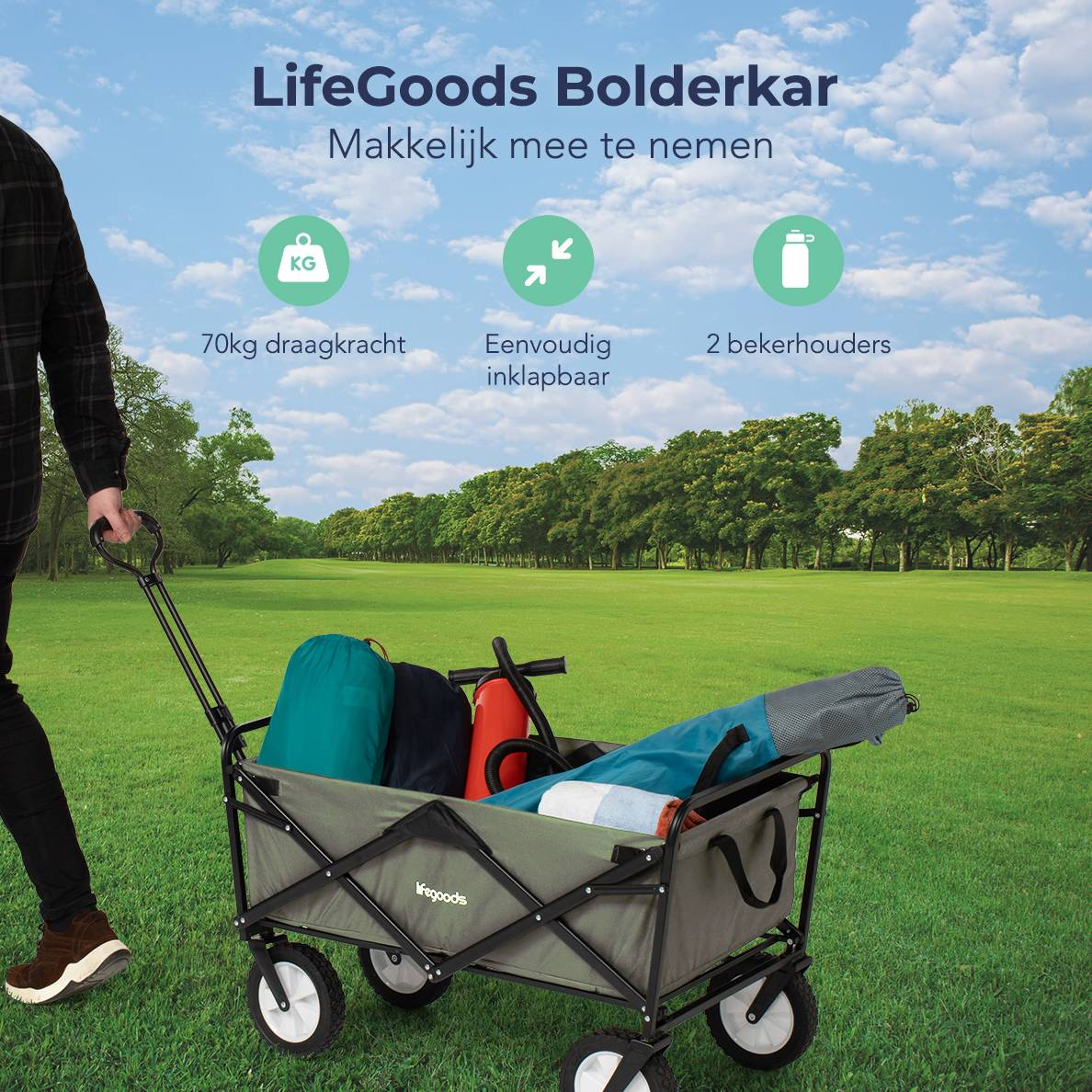 A man pulling a green wagon loaded with gear on grass. Text: '70kg draagkracht' (70kg capacity).