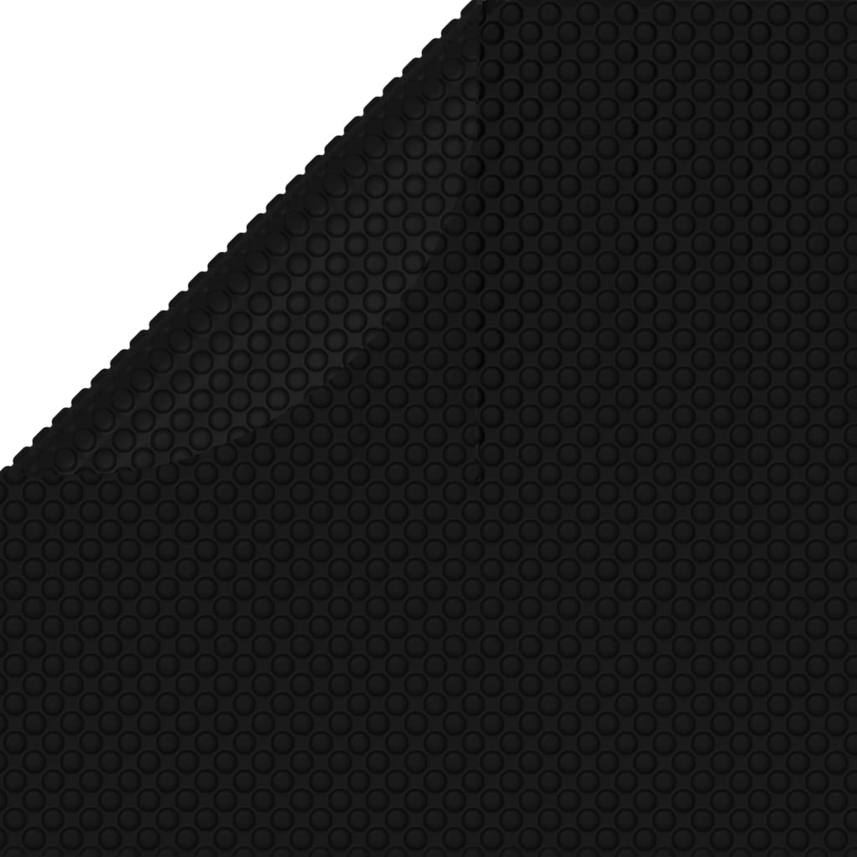 Eine schwarze Gummimatte mit einem strukturierten, kreisförmigen Muster. Eine Ecke der Matte ist sichtbar.