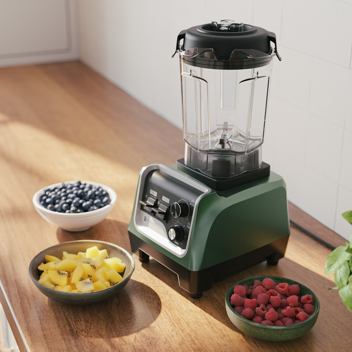 Blender with ingredients: blueberries, chopped kiwi, and raspberries on a wooden counter.
