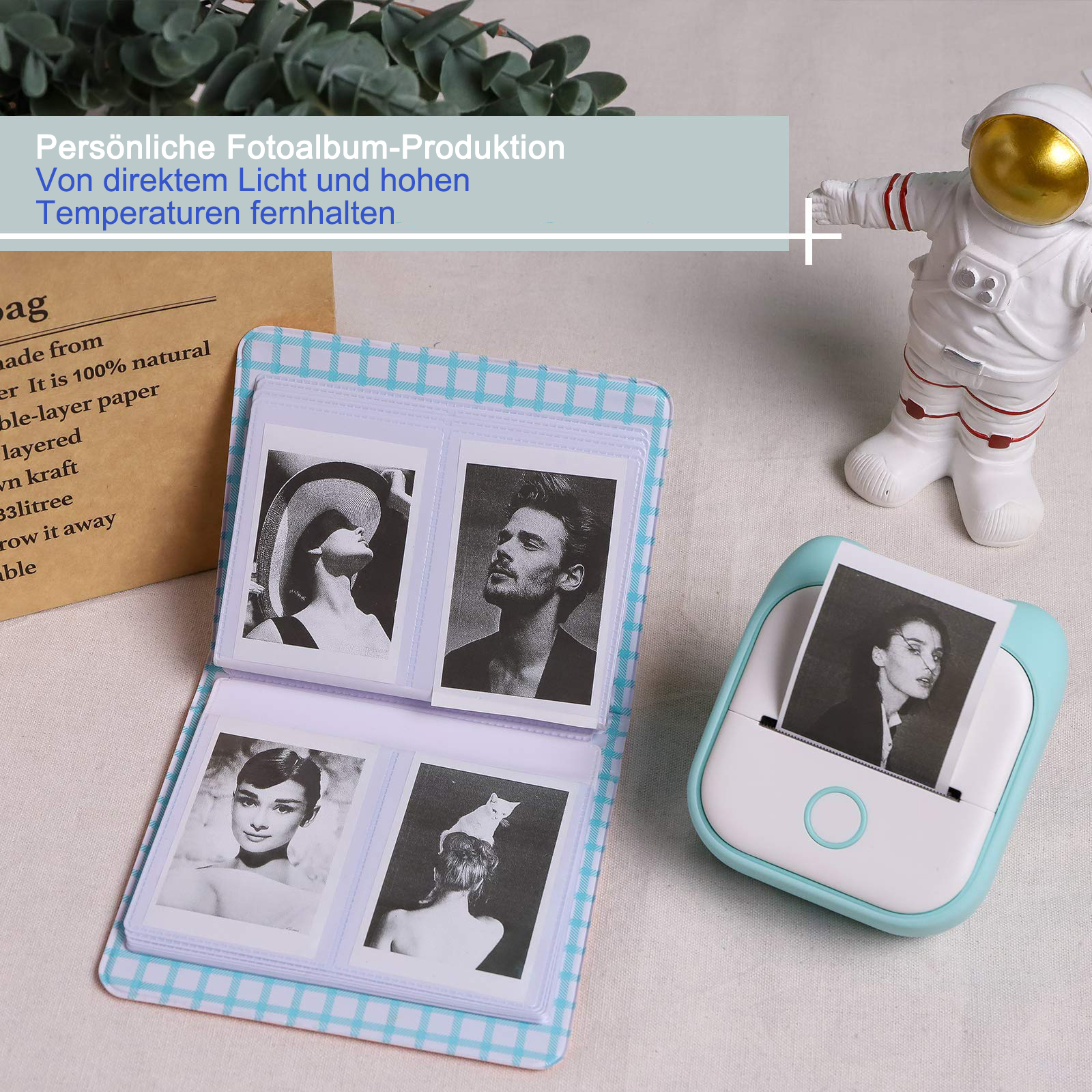Fotos in einem Fotoalbum, gedruckt von einem kleinen türkisgrünen Drucker.
