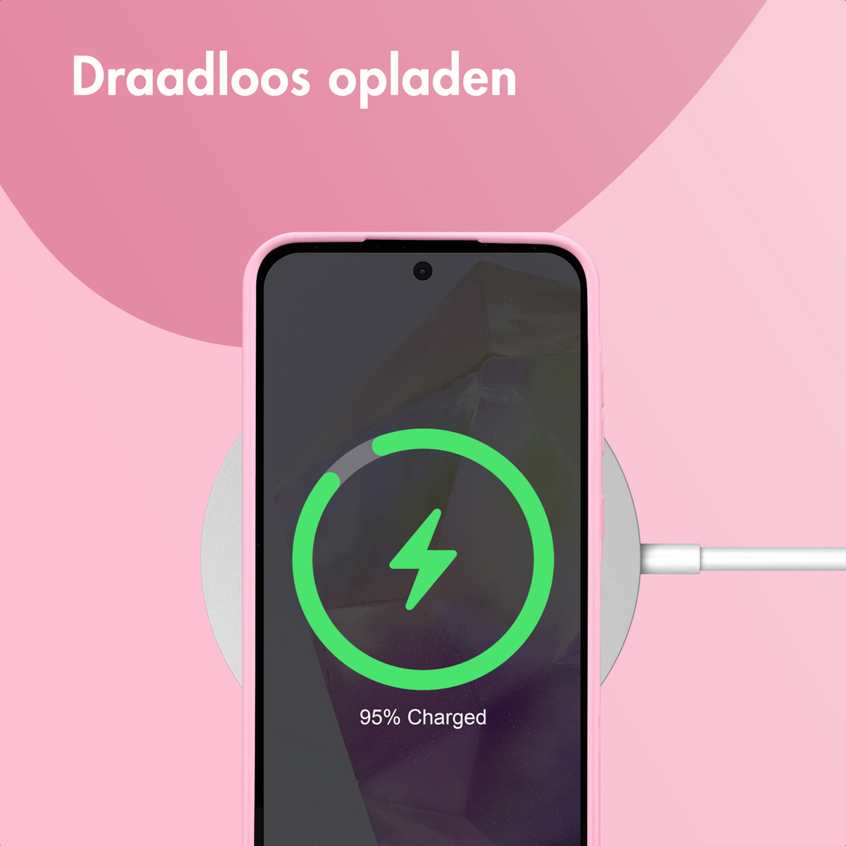 De afbeelding toont een roze telefoon met een oplaadsymbool tegen een roze achtergrond, met de tekst "Draadloos opladen".