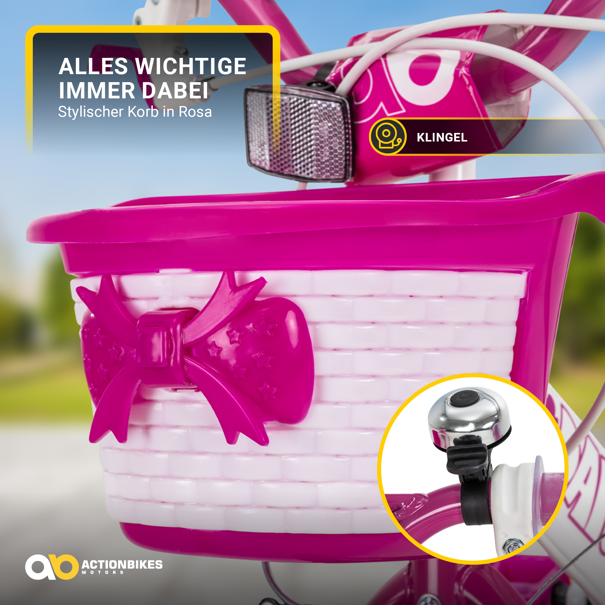 Nahaufnahme des Korbs und der Klingel an einem rosa-weißen Kinderfahrrad. Ein Bogen ist vorhanden.