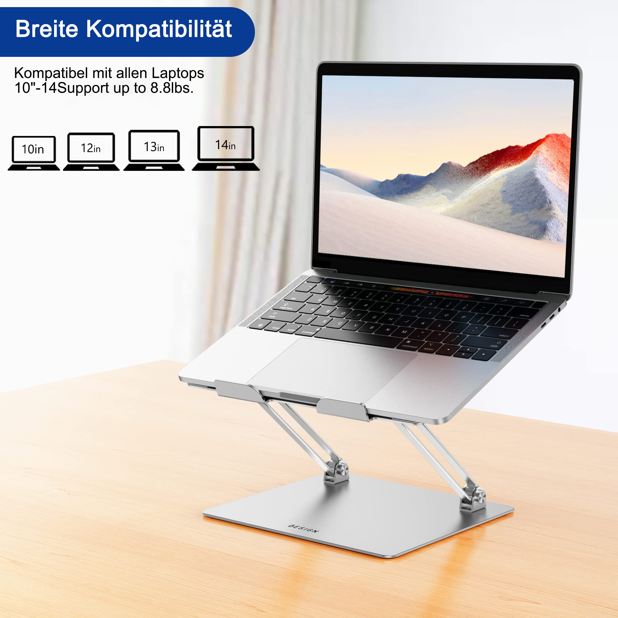 Ein silberner Laptop-Ständer. Ein Laptop ist darauf platziert, auf einem Holztisch gezeigt. Der Ständer ist kompatibel mit 10-14 Zoll Laptops.