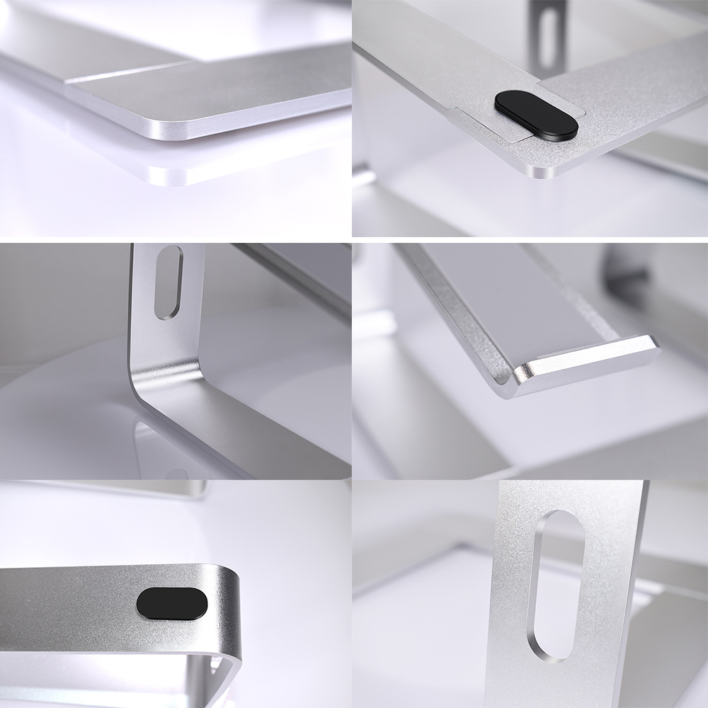 Nahaufnahme von Metallständerkomponenten mit Kanten, Löchern und einem schwarzen Knopf. Die Oberfläche ist glatt und reflektierend.