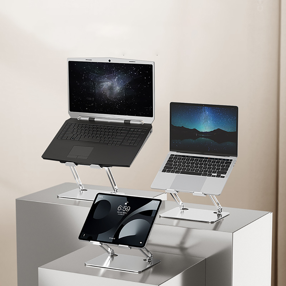 Drei Laptops und ein Tablet stehen auf Ständern. Zeigt ein modernes und minimalistisches Design.