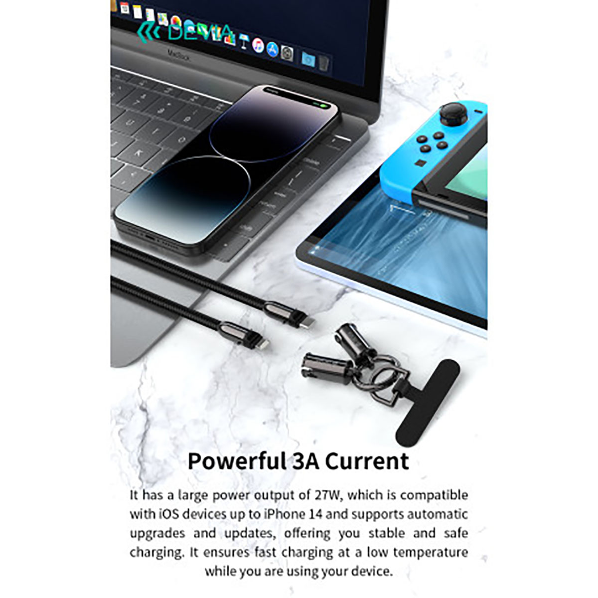 Un telefono, cavi e altri oggetti tecnologici su una superficie di marmo. Sono visibili anche un laptop e un controller di gioco blu.