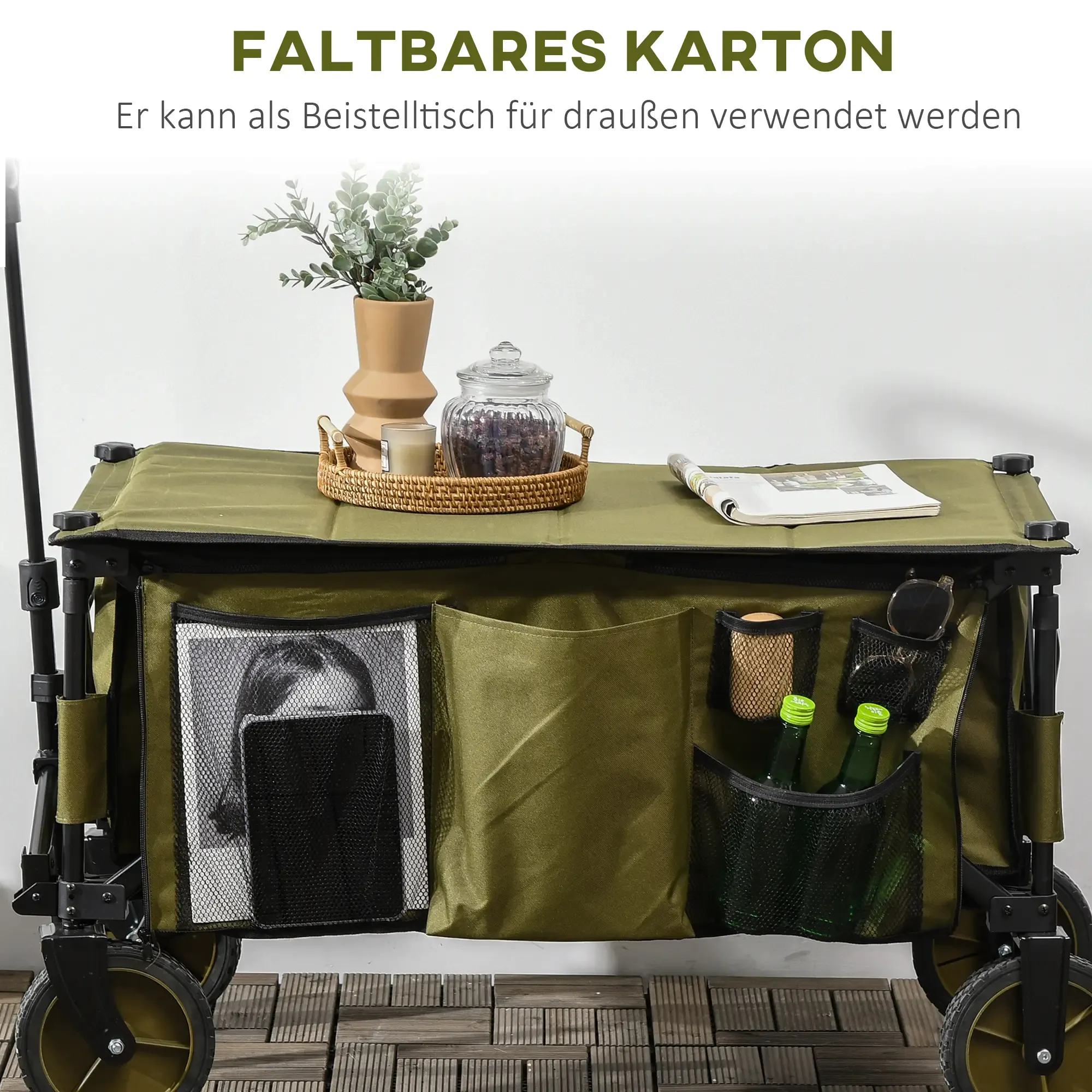Grüner Klappwagen mit Gegenständen. Enthält eine Pflanze, ein Glas, Flaschen und eine Zeitschrift.