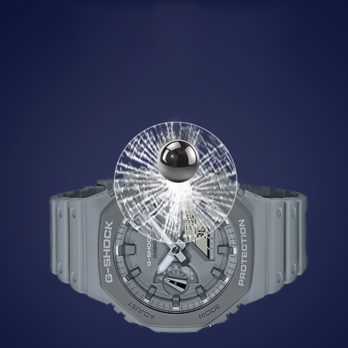 Un orologio G-Shock grigio con una sovrapposizione trasparente e uno sfondo blu scuro.
