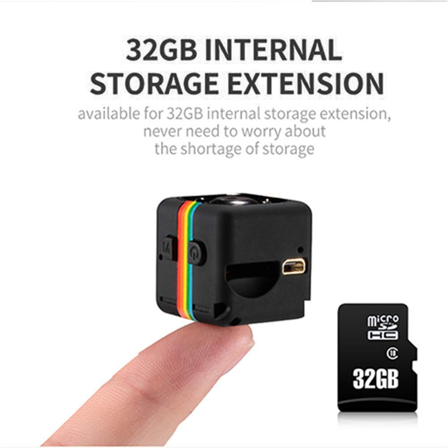 Schwarze Würfelkamera mit Regenbogenstreifen, gehalten von einem Finger, neben einer 32GB Micro-SD-Karte. Text: '32GB interner Speichererweiterung'.