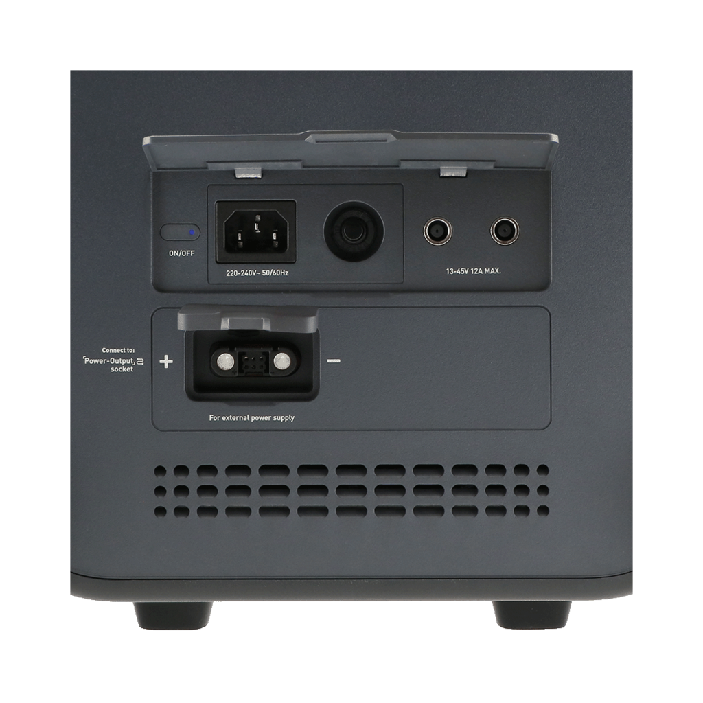 A dark gray power device with various input/output ports. Labels include voltage, power output, and external power supply.
