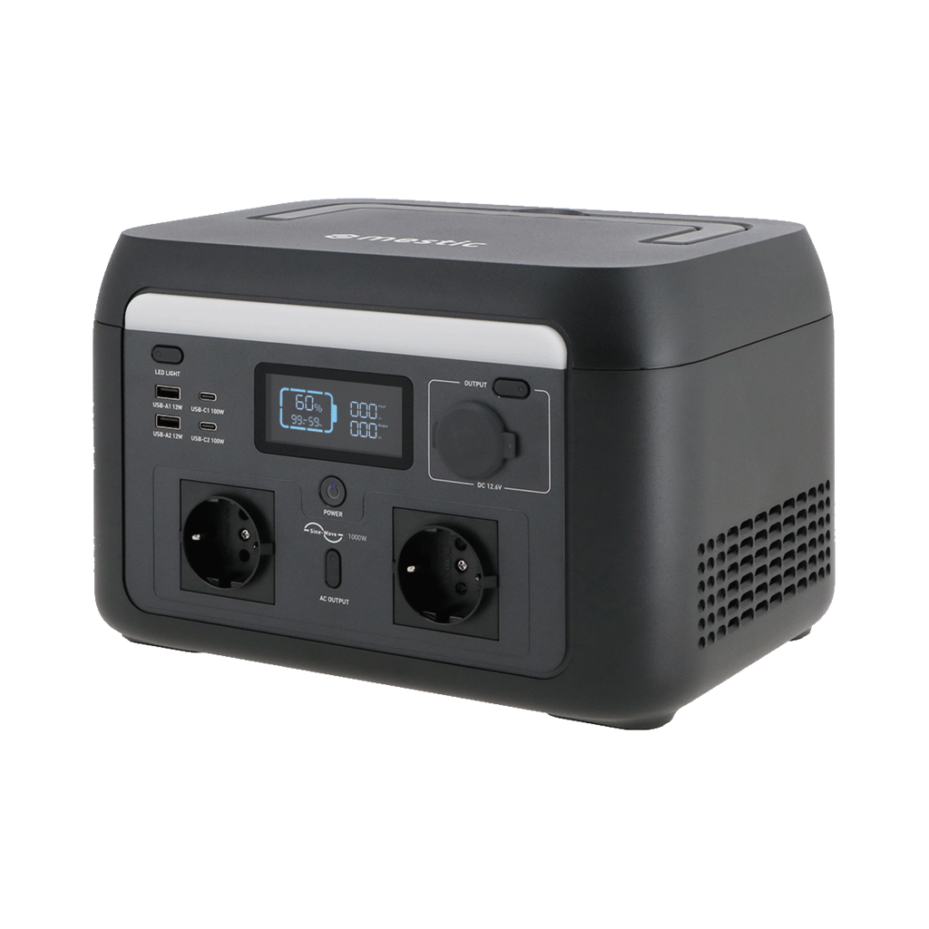 Black portable power station. It has a digital display showing battery life and output ports. It has multiple plugs and USB ports.
