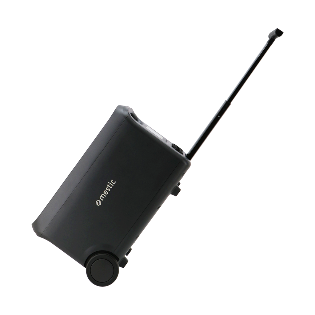 A black Dometic rolling cooler with a pull handle and two wheels, set against a black background.
