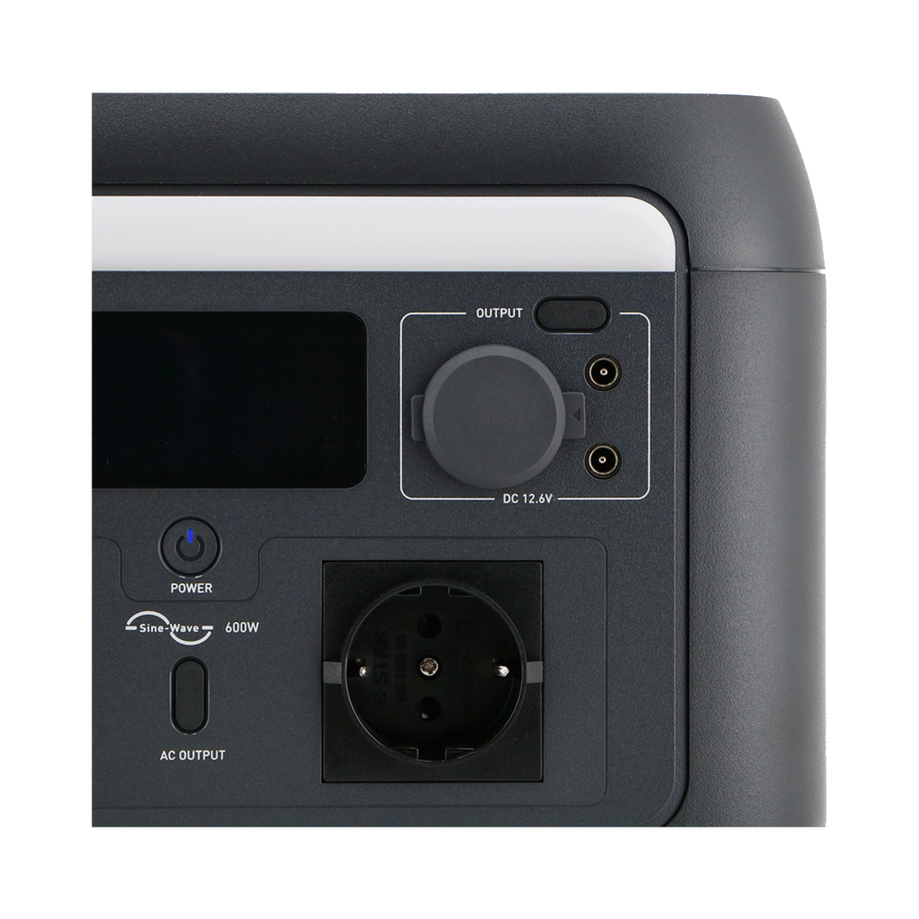 A dark gray power station showing output, power, and AC output sections. Includes a dial, power button, and an outlet.