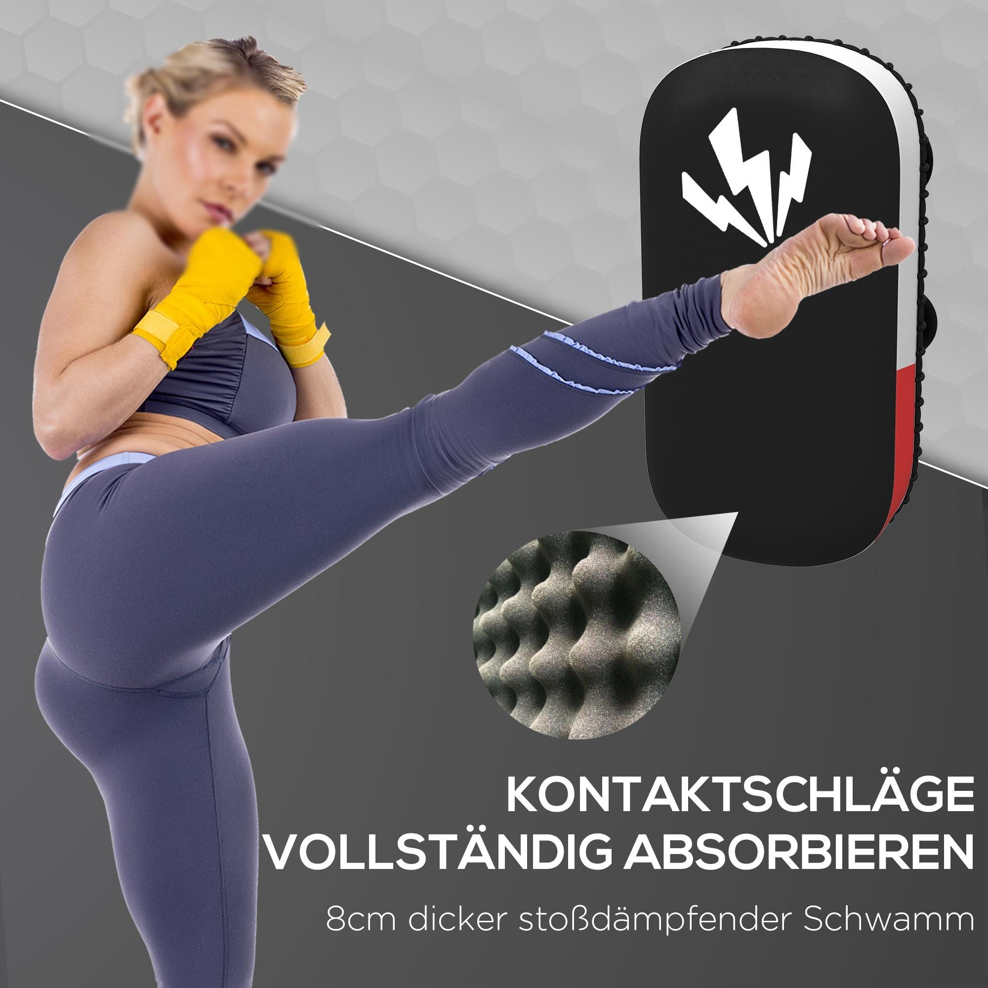 Eine Frau in Sportkleidung tritt auf ein Pad. Das Pad ist schwarz, und die Frau trägt gelbe Handwickel.